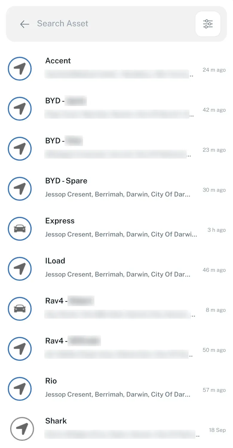 The vehicle list on a phone, opened from the search bar, showing each vehicle’s name, location and how long ago it last reported. Names and addresses are blurred