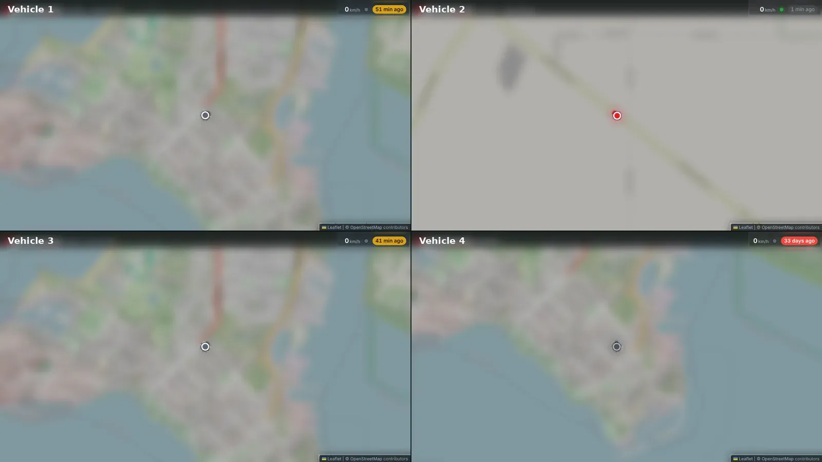A wall map with four live map panels, one vehicle in each, showing its speed and when it last reported.